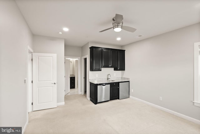 kitchen with visible vents, baseboards, dishwasher, and dark cabinets