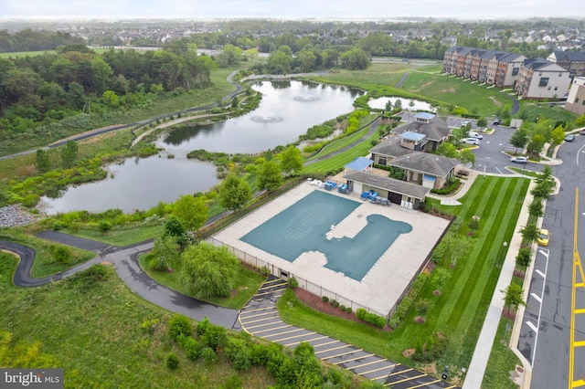 birds eye view of property featuring a water view