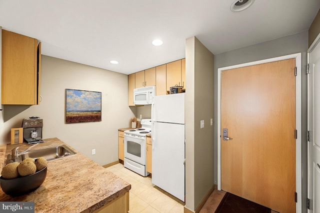 kitchen featuring white appliances, recessed lighting, light countertops, a sink, and light tile patterned flooring