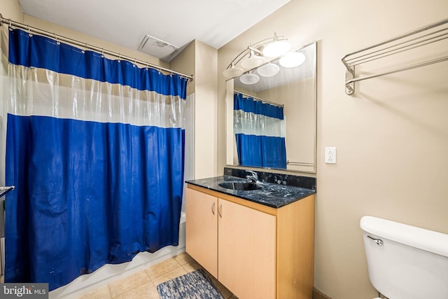 bathroom featuring toilet, tile patterned floors, visible vents, vanity, and shower / tub combo with curtain