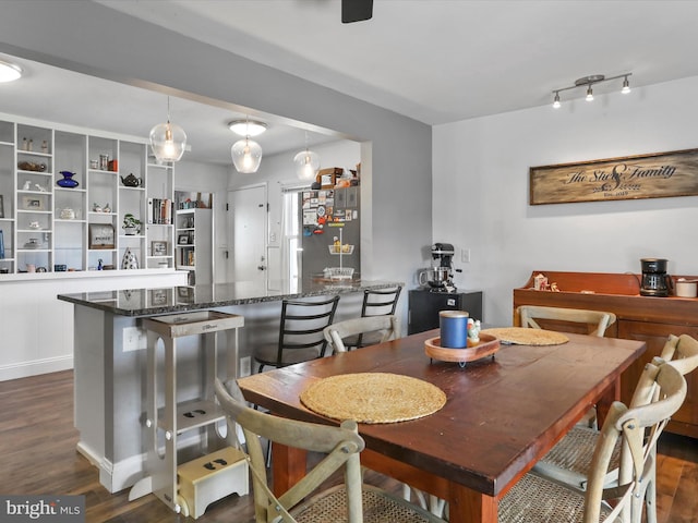 dining room featuring dark wood-style flooring