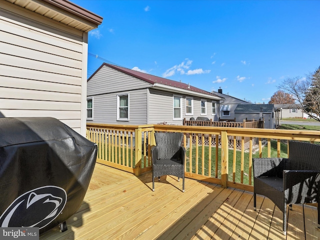 wooden deck featuring grilling area