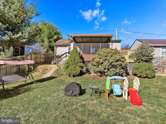 exterior space with a sunroom and a fenced backyard