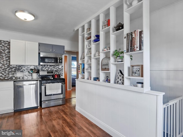 kitchen featuring open shelves, dark countertops, backsplash, appliances with stainless steel finishes, and dark wood-type flooring