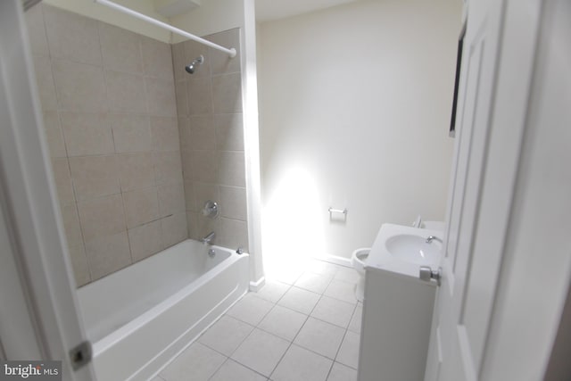 bathroom featuring tile patterned flooring, bathtub / shower combination, baseboards, and vanity