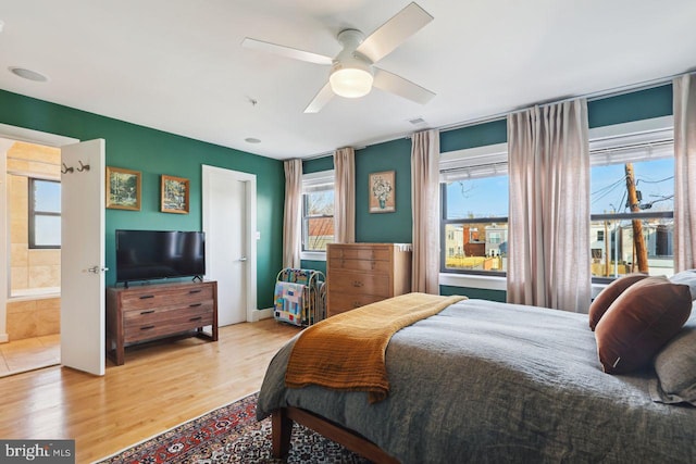 bedroom with wood finished floors and a ceiling fan