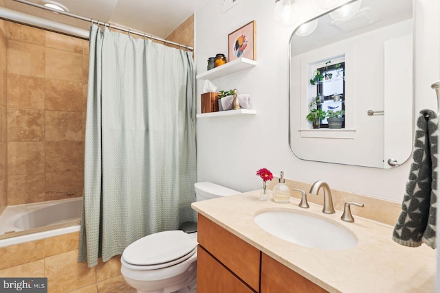 bathroom with toilet, tile patterned floors, tiled shower / bath combo, and vanity