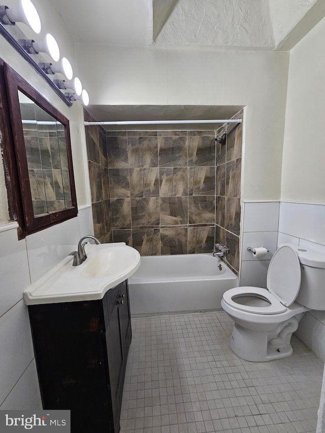 bathroom featuring  shower combination, tile patterned flooring, vanity, and toilet