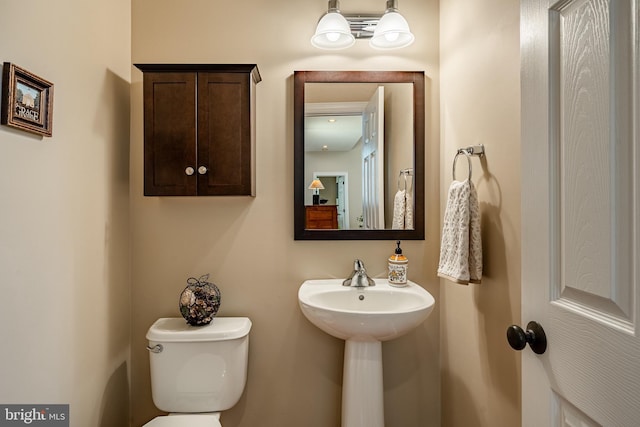 bathroom with a sink and toilet