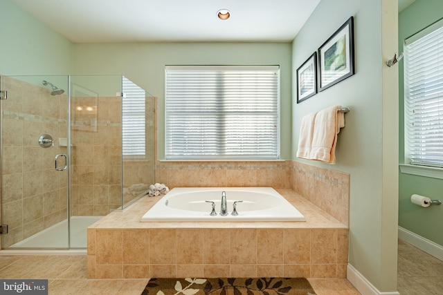 full bath featuring a garden tub, a shower stall, plenty of natural light, and tile patterned flooring