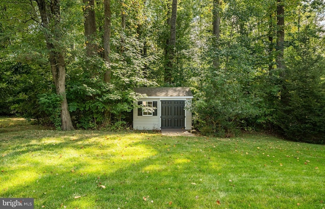 view of shed with a forest view