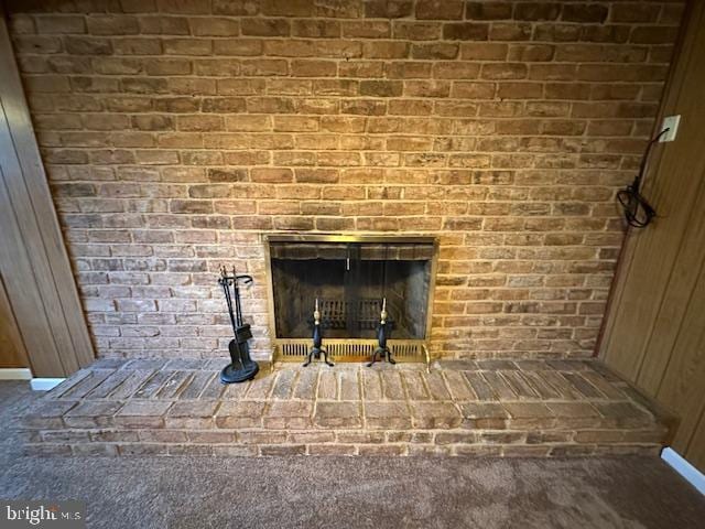 interior details with a brick fireplace