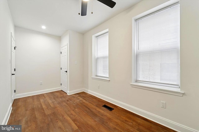 unfurnished room featuring recessed lighting, wood finished floors, a ceiling fan, visible vents, and baseboards