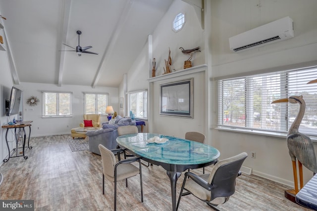 dining area with ceiling fan, beamed ceiling, an AC wall unit, wood finished floors, and high vaulted ceiling