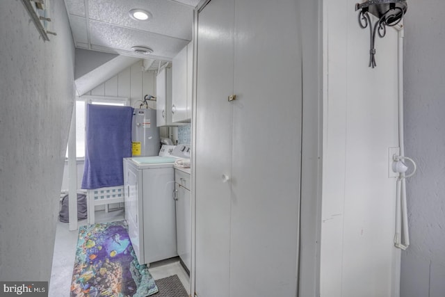 bathroom with visible vents, concrete floors, water heater, a textured wall, and independent washer and dryer