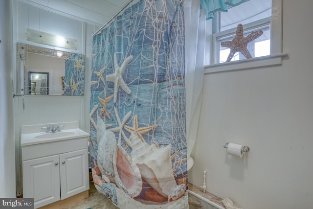 bathroom featuring vanity and crown molding