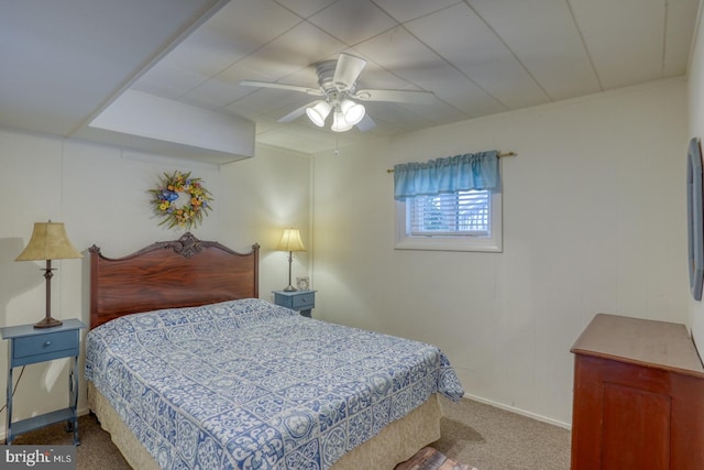 carpeted bedroom with baseboards and ceiling fan