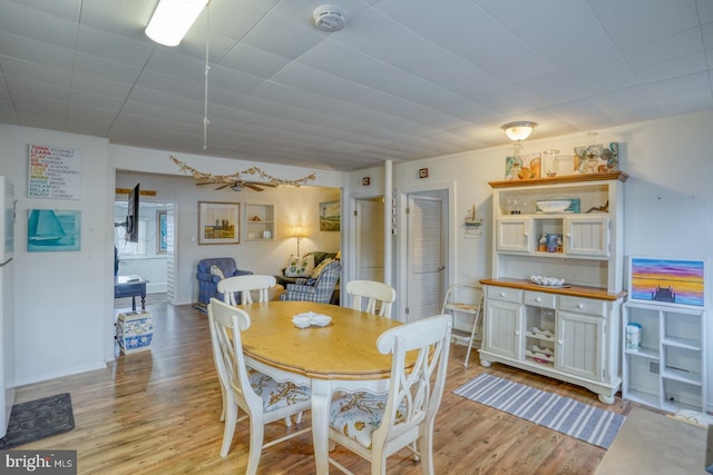 dining space featuring light wood-style flooring