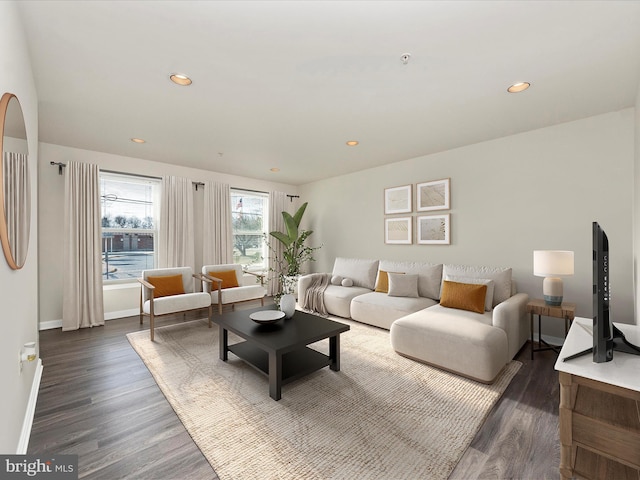 living room featuring dark wood-style floors, baseboards, and recessed lighting