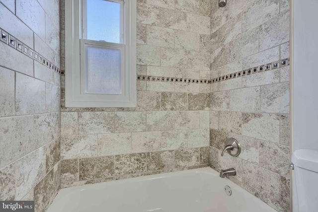 full bathroom with bathtub / shower combination and toilet