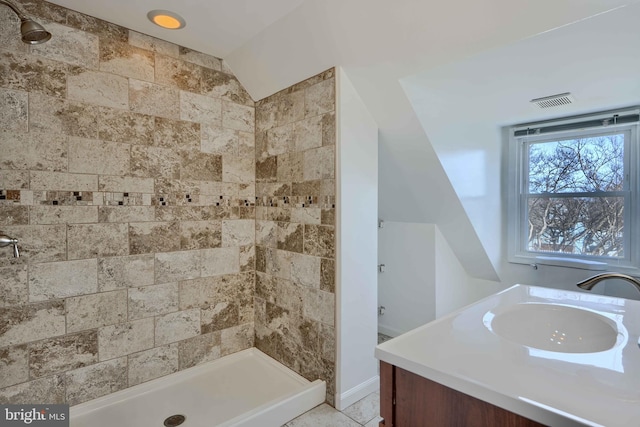 full bath with lofted ceiling, a stall shower, and vanity