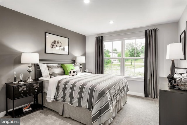 bedroom with carpet floors and baseboards