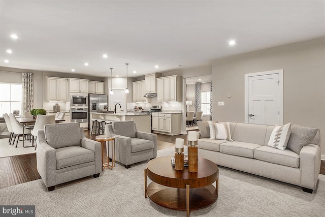 living room featuring recessed lighting and light wood-style flooring