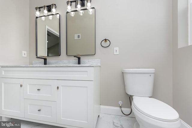 bathroom featuring marble finish floor, visible vents, toilet, vanity, and baseboards