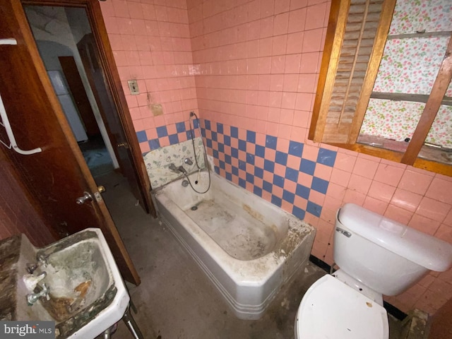 bathroom featuring a shower, tile walls, and toilet