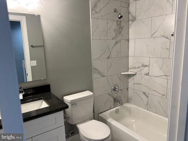 bathroom featuring vanity, toilet, and bathing tub / shower combination