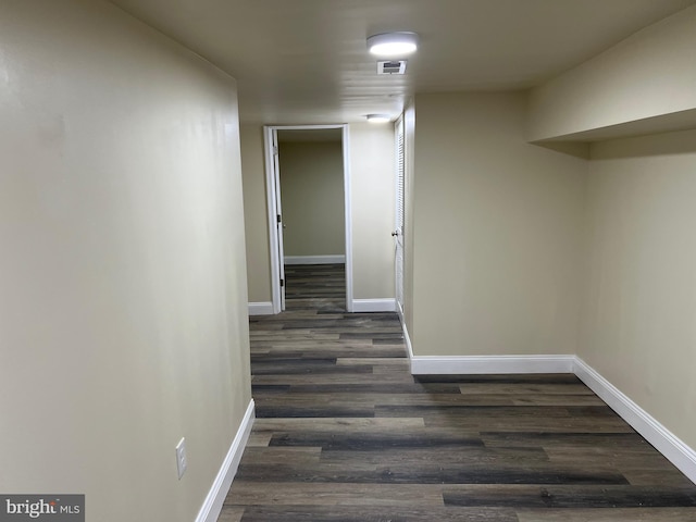 hall with visible vents and baseboards