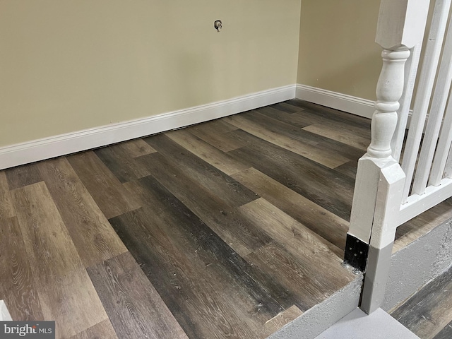 details featuring wood finished floors and baseboards