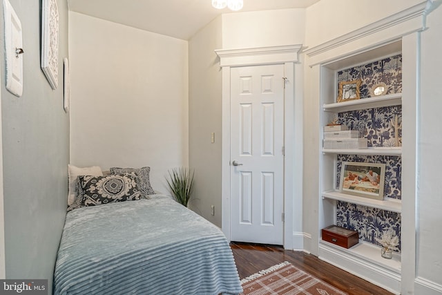 bedroom featuring dark wood-style flooring