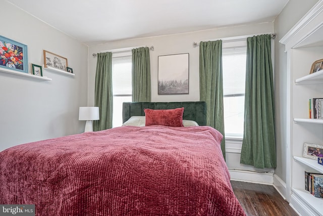 bedroom with wood finished floors