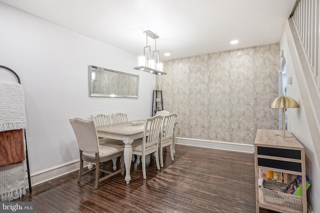 dining space featuring recessed lighting, wood finished floors, and baseboards