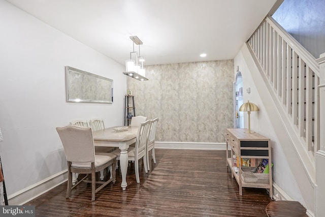 dining area featuring recessed lighting, baseboards, wood finished floors, and stairs