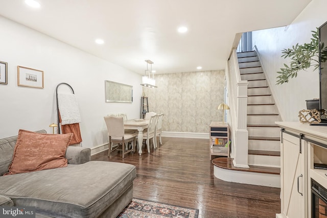 living area with recessed lighting, stairway, baseboards, and dark wood-style floors