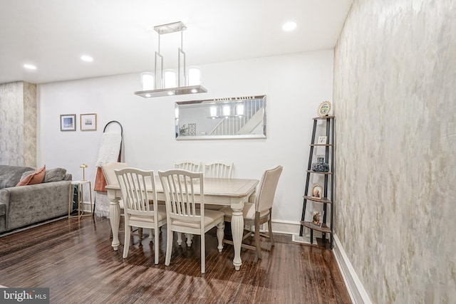 dining area featuring recessed lighting, baseboards, and wood finished floors