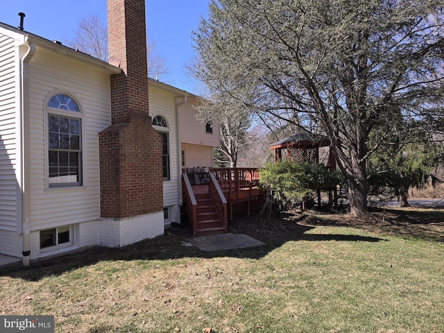 view of yard featuring a wooden deck