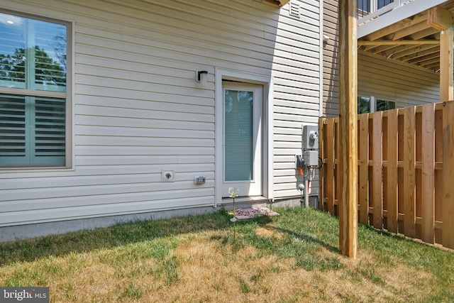 view of property exterior featuring fence