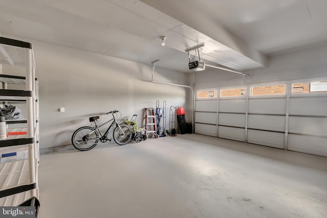 garage with a garage door opener and bike storage