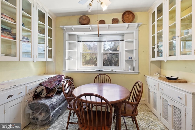 dining room featuring brick floor