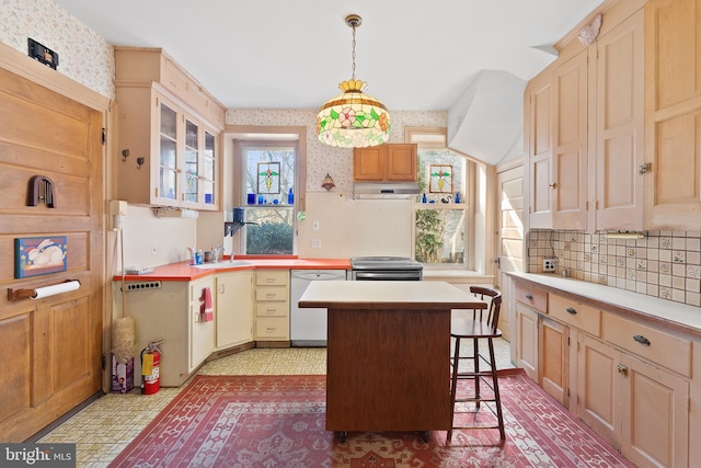 kitchen with wallpapered walls, dishwasher, stainless steel electric stove, light countertops, and under cabinet range hood