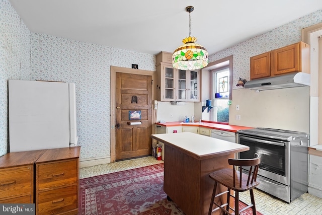 kitchen with wallpapered walls, under cabinet range hood, white appliances, and a center island