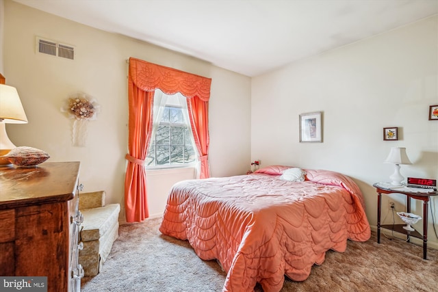 carpeted bedroom with visible vents