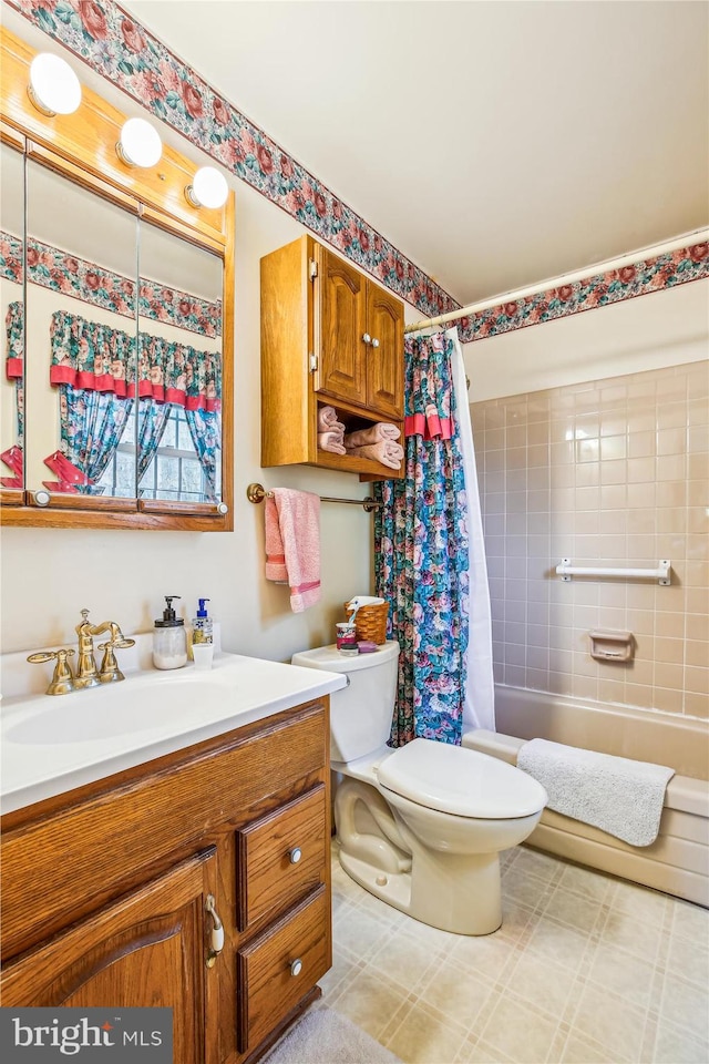 bathroom with vanity, shower / tub combo, and toilet