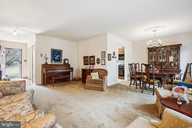 carpeted living room featuring a chandelier and crown molding