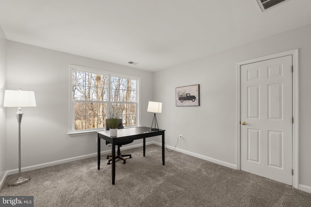 home office featuring carpet, visible vents, and baseboards