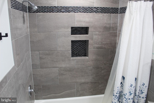 full bathroom with shower / tub combo with curtain