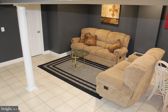 living room featuring light tile patterned floors and baseboards